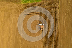 Traktor working on spring field