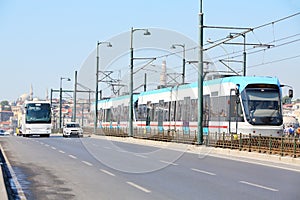 Tram, bus and car at sunny summer day