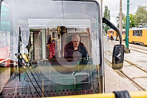 Tram driver runs the tram. Transport
