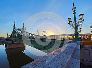 The tram on the Liberty Bridge on sunrise, Budapest, Hungary