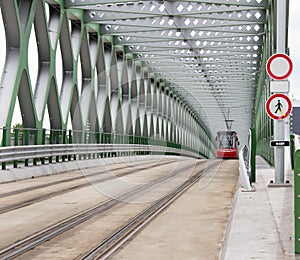 Tram on modern bridge