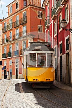 Tram on narrow street of Alfama, Lisbon