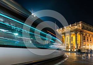 Tram passing the Grand ThÃ©Ã¢tre de Bordeaux at night in New Aquitaine, France