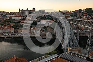 Tram and pedestrians cross the Ponte Luis in Porto