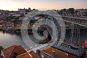 Tram and pedestrians cross the Ponte Luis in Porto