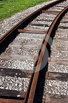 Tram rail road track disappearing around a curve