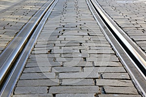 Tram rails on cobbled road surface