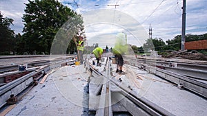 Tram rails at the stage of their installation and integration into concrete plates on the road timelapse hyperlapse.