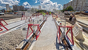 Tram rails at the stage of their installation and integration into concrete plates on the road timelapse hyperlapse.