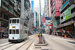 A tram travels along Hennessy Road in downtown Causeway Bay, Hong Kong