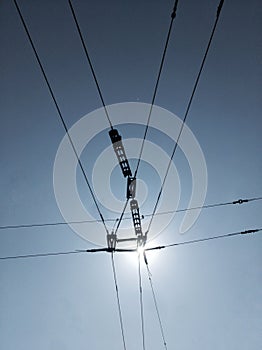tram wires cable electricity sky and sun