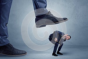Trampled small businessman in suit