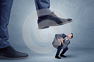 Trampled small businessman in suit