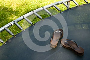 Trampoline with Flipflops photo