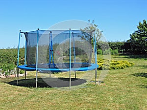 Trampoline in a garden photo