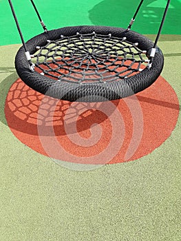 Trampoline in outdoor children`s play area. Children`s fun and entertainment. Play ground games