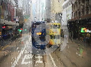 Trams in Hong Kong through wet window