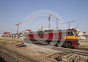 Trane with construction site in background
