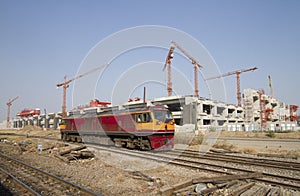 Trane with construction site in background