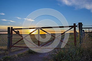 Tranquera and sunset in Pampeano countryside,