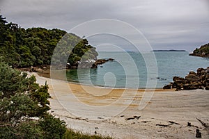 Tranquil beach at Harold Bay in Stewart Island or Rakiura, New Zealand.