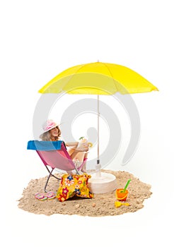 Tranquil beach with woman in chair