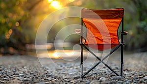 Tranquil camping oasis sunlit stream, folding chair on gravel road, nature s serenity