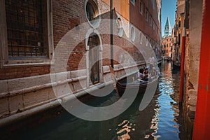 Tranquil gondola ride through the picturesque canals of Venice, Italy - serene travel concept.