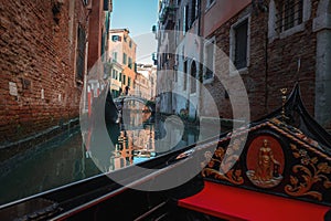 Tranquil Gondola Ride on Venice Canal: Serene Summertime Scene in Italy