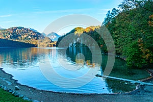 Tranquil lake in Alps with mountains on a background in the morning in autumn