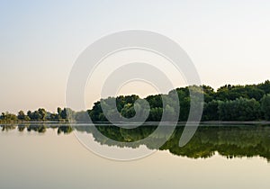 Tranquil lake with reflections at dawn or dusk