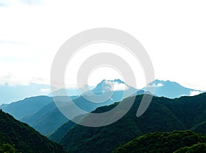 Layered Blue Mountain Ridges Under White Sky â AI-Generated