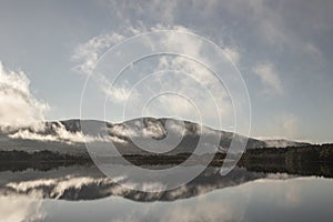 Tranquil Loch Garten and mist in the Highlands of Scotland.