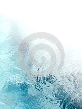 Tranquil and meditative blue green flowing water ripples photo