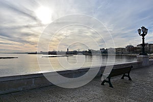 Tranquil morning, empty bench, no people on Bari sea promenade