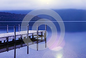 Tranquil peaceful lake with jetty New Zealand Concept