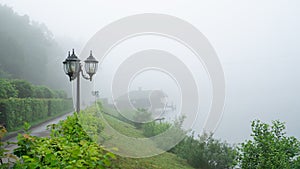 Tranquil peaceful place to deep thoughts. lonely lake shore and mist. mystical morning foggy weather. background