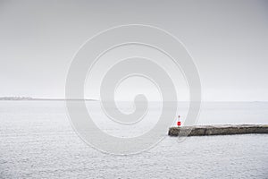 Tranquil peaceful water stone jetty pier at lake