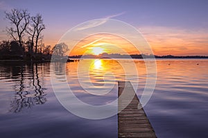Tranquil purple Sunset over Serene Lake