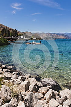 Tranquil Rocky Shore of Lake Chelan on a Sunny Day