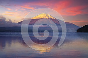 A tranquil scene of mount Fuji and Lake Yamanaka at sunrise