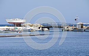 Tranquil scene os small fishing boats in the harbor of Skyros island , Greece