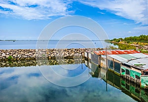 Tranquil seascape with shanties, Delta del Po, Adriatic Sea, Italy