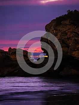 Tranquil shore with a rugged landscape of eroded rocks