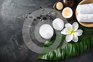 A tranquil spa setting featuring smooth pebbles, a lit candle spa-themed concepts