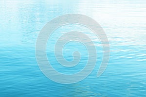 Tranquil surface texture of the ocean. Water ripples. Blue sea water in calm. Crystal clear sea water texture background. Turquois