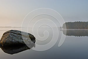 Tranquill lake in early morning mist