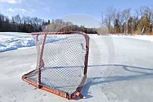 Tranquillity scene of hockey rink in the frozen lake photo