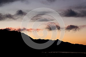 Tranquillity view sunset sky against mountain silhouette photo