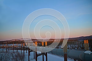Trans-Alaska Pipeline at sunset in winter